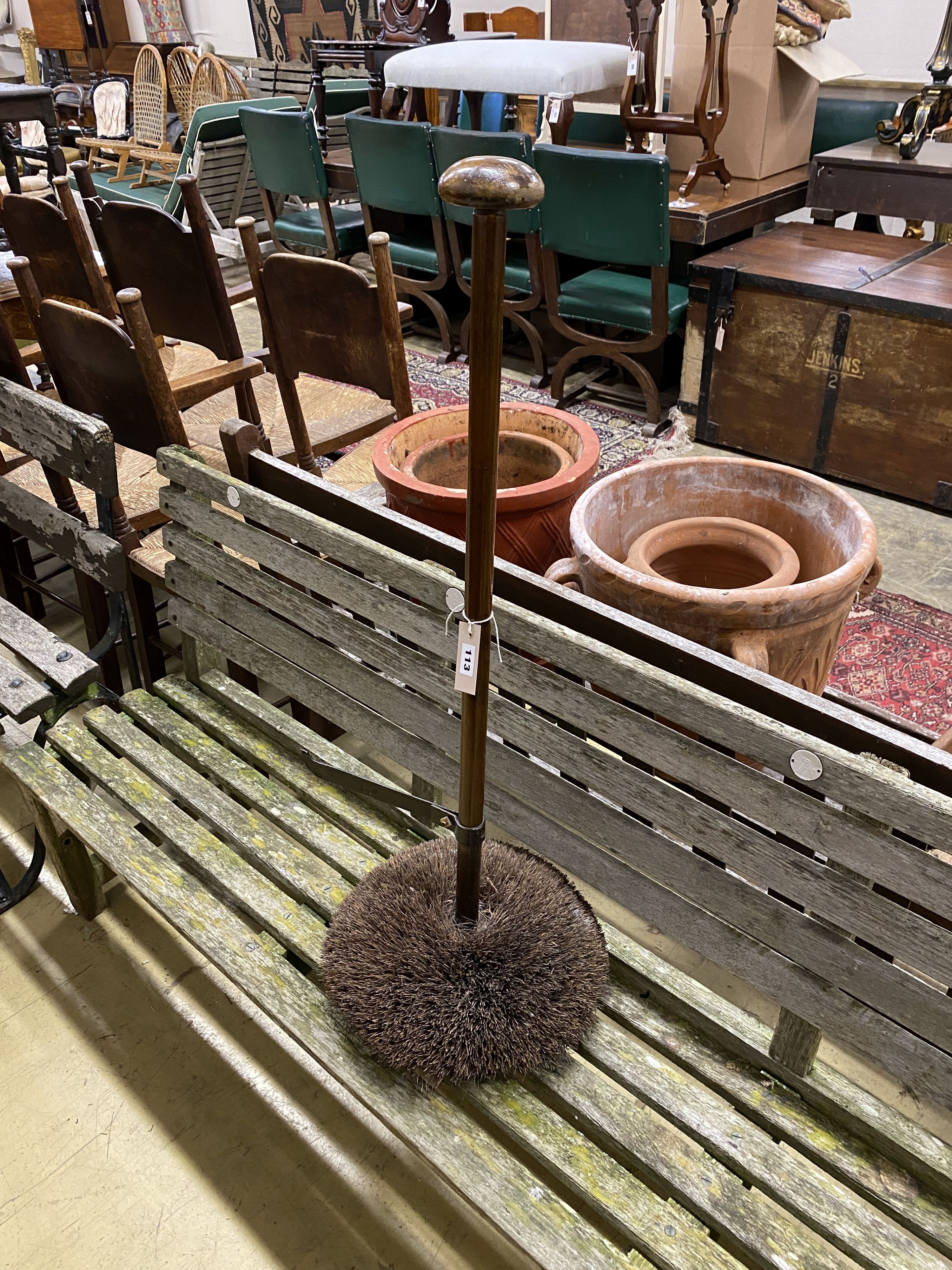 A boot brush and scraper with turned wood handle, height 90cm